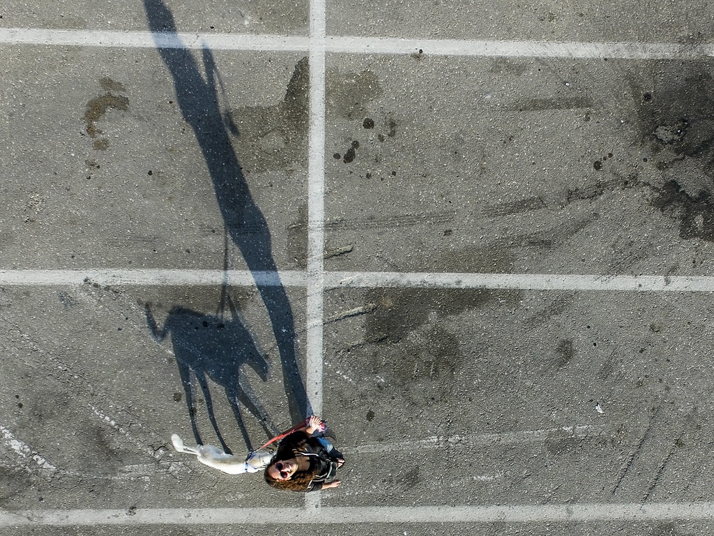 A consumer drone flying outdoors against a sky background (remote id)