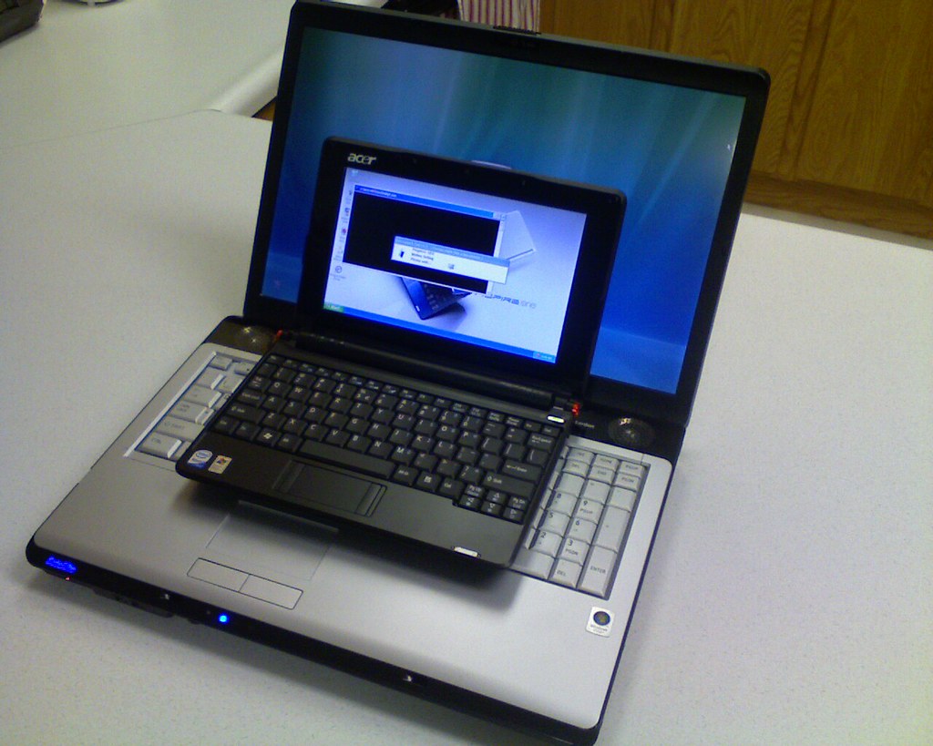 A laptop's USB-C charging port with a cable plugged in