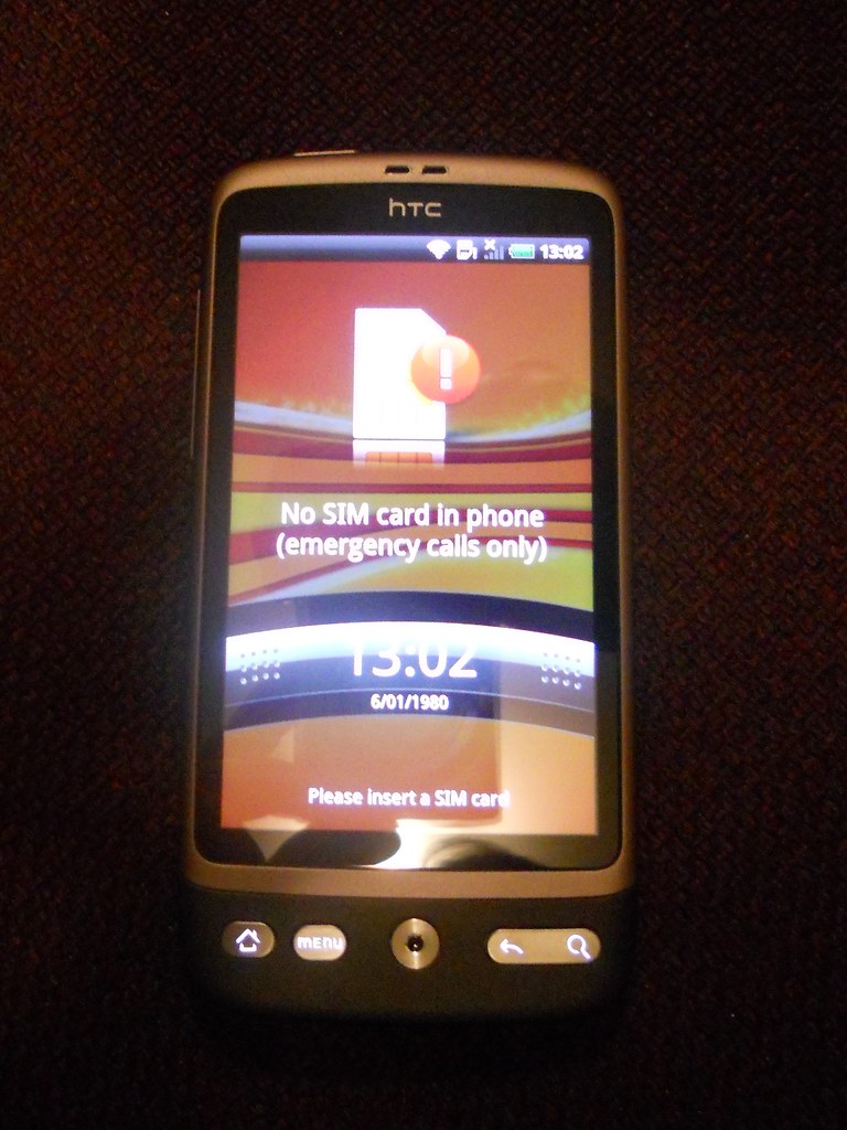 A smartphone with a SIM card being inserted (mvno)