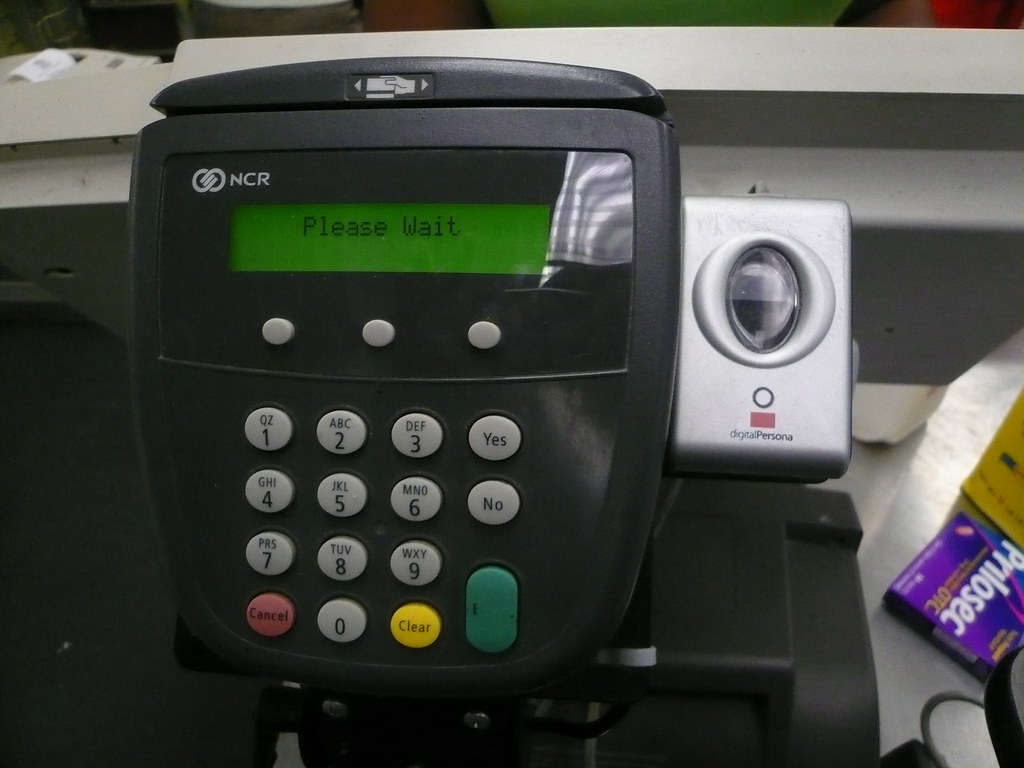 A smartphone showing a fingerprint biometric login screen