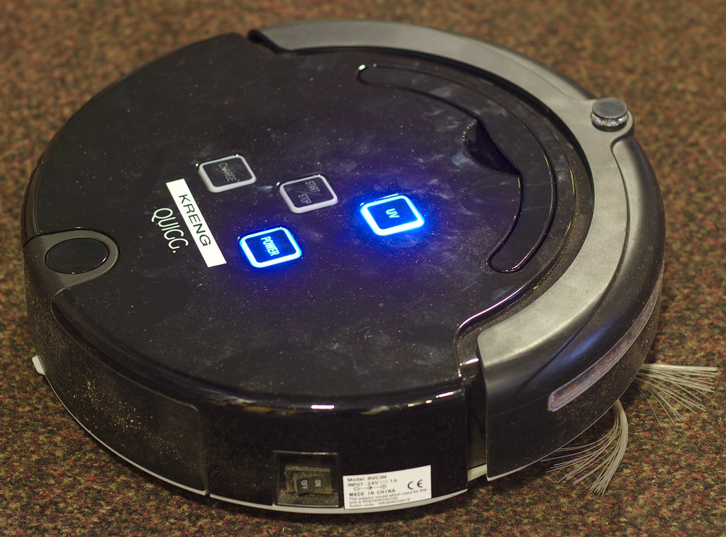 A robot vacuum cleaner navigating a living room floor