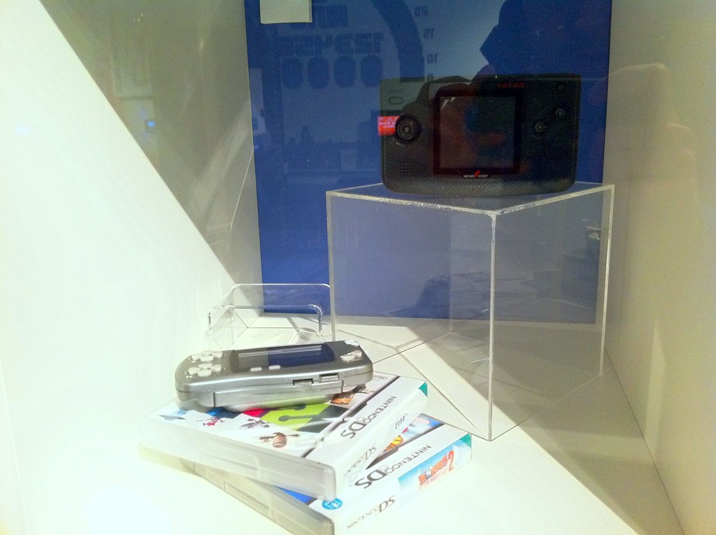 A handheld gaming PC console held in two hands