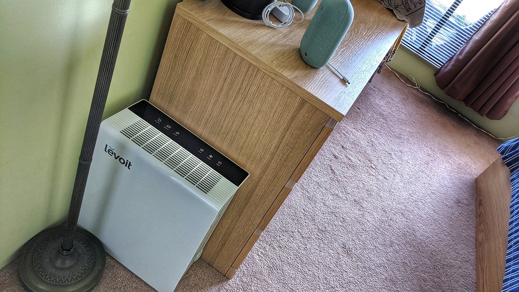 A Levoit air purifier standing in a room
