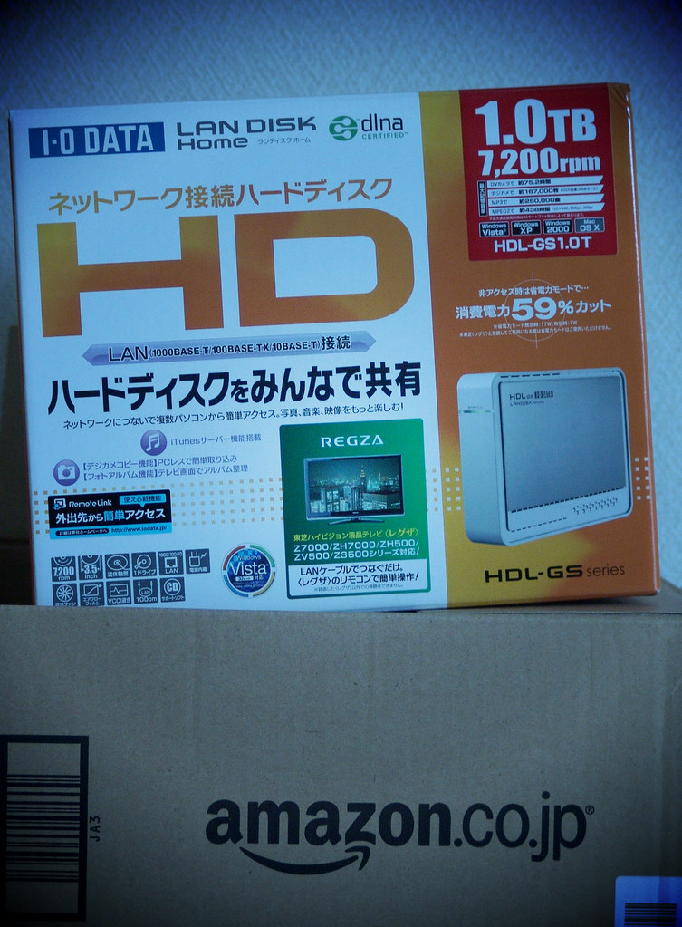 A network-attached storage device with visible hard drive bays on a desk (nas) (home nas)