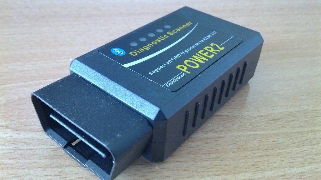 A small OBD2 diagnostic scanner dongle (obd2 scanner)
