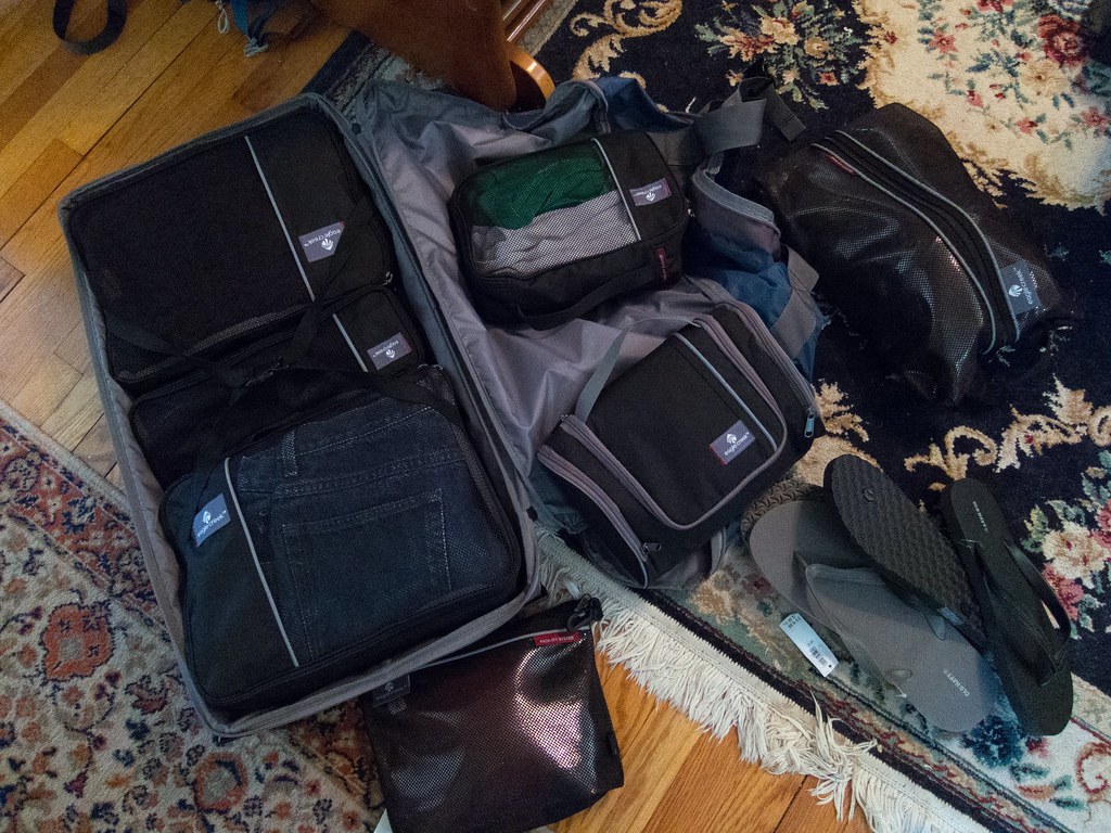 Packing cubes neatly organized inside an open suitcase
