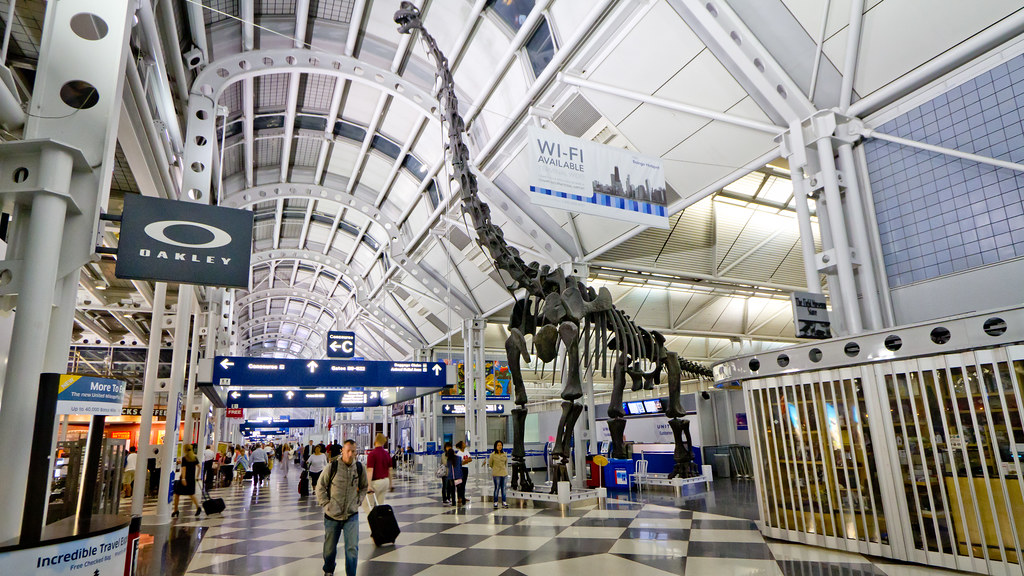 Travelers moving through an airport security checkpoint line (global entry) (tsa precheck)